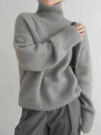Grey roll neck jumper with ribbed hem and cuffs, styled with matching wide-leg trousers