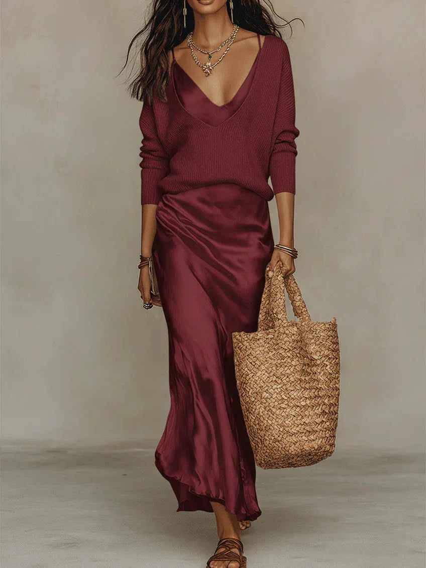 Front view of the satin slip dress showing its fluid drape and delicate cowl-style V-neckline