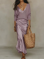 Lilac satin slip skirt with a matching lilac ribbed knit jumper, front view showing the flowing hem