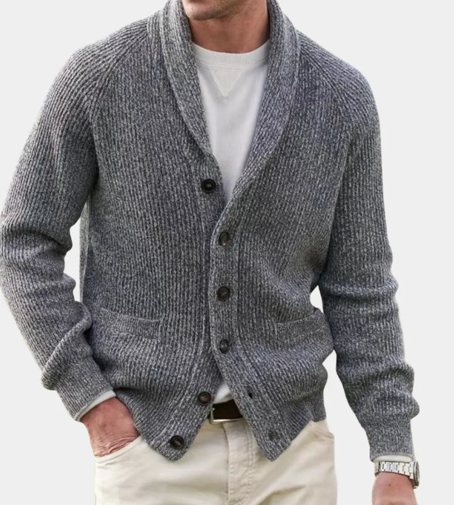 Man wearing a grey marl shawl-collar ribbed knit cardigan with button front, styled over a white sweatshirt