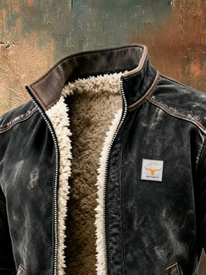 Close-up of the stand collar and open zip showing thick cream sherpa fleece lining against the leather shell