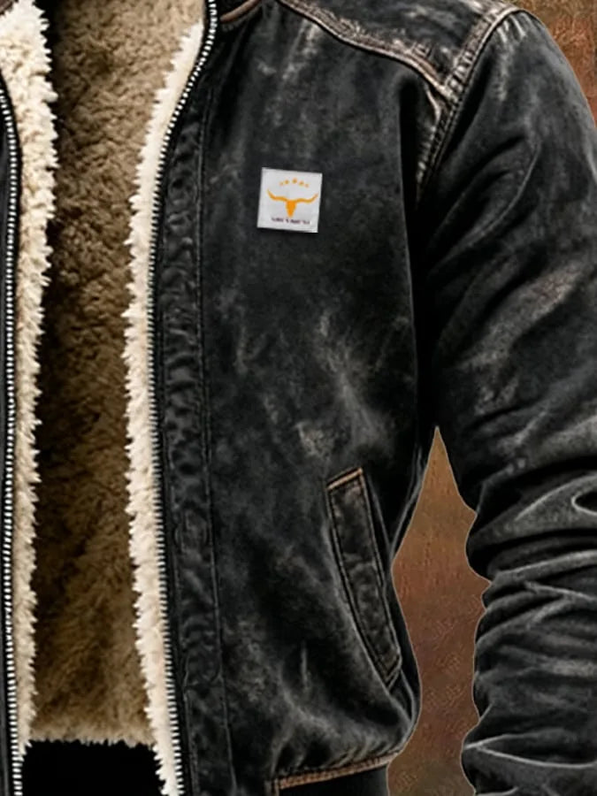 Side detail of the chest patch, slanted pocket and contrast stitching on the black leather jacket