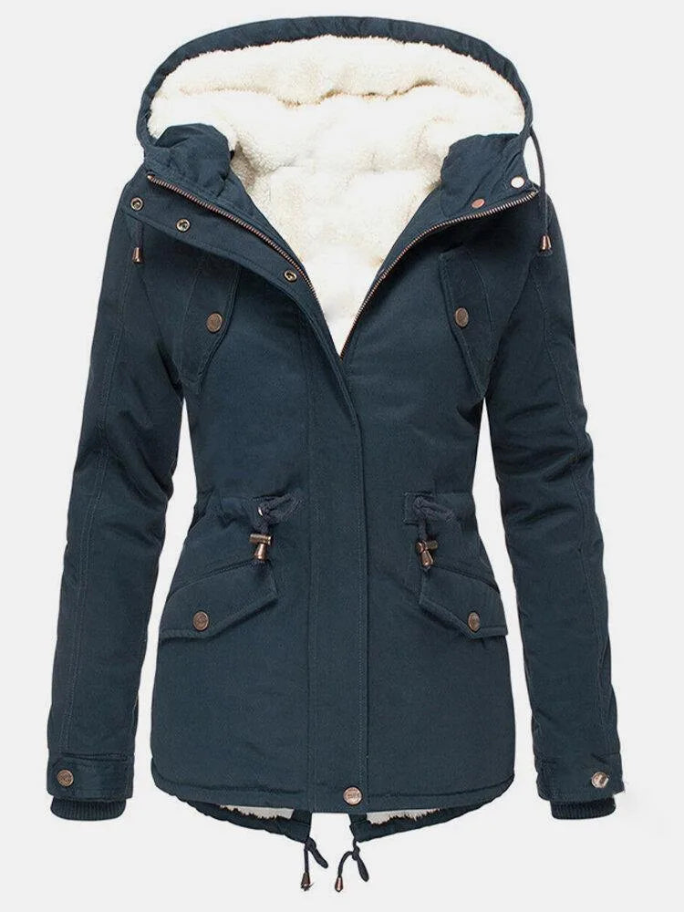 Navy blue hooded parka with the zip half open, showing the cosy cream sherpa lining and popper cuffs.