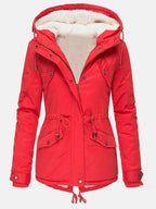 Red hooded parka photographed from the front, unzipped to reveal the soft sherpa lining and bronze-tone hardware.