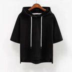 Black short-sleeve hoodie on a hanger, front view highlighting the banded cuffs and side vents