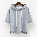 Grey marl short-sleeve hoodie on a hanger, close-up of the drawstring hood and dropped shoulders