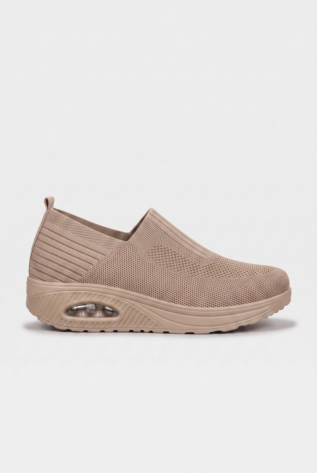 Side profile of light brown knit slip-on trainer with tonal wedge sole and ribbed side panel