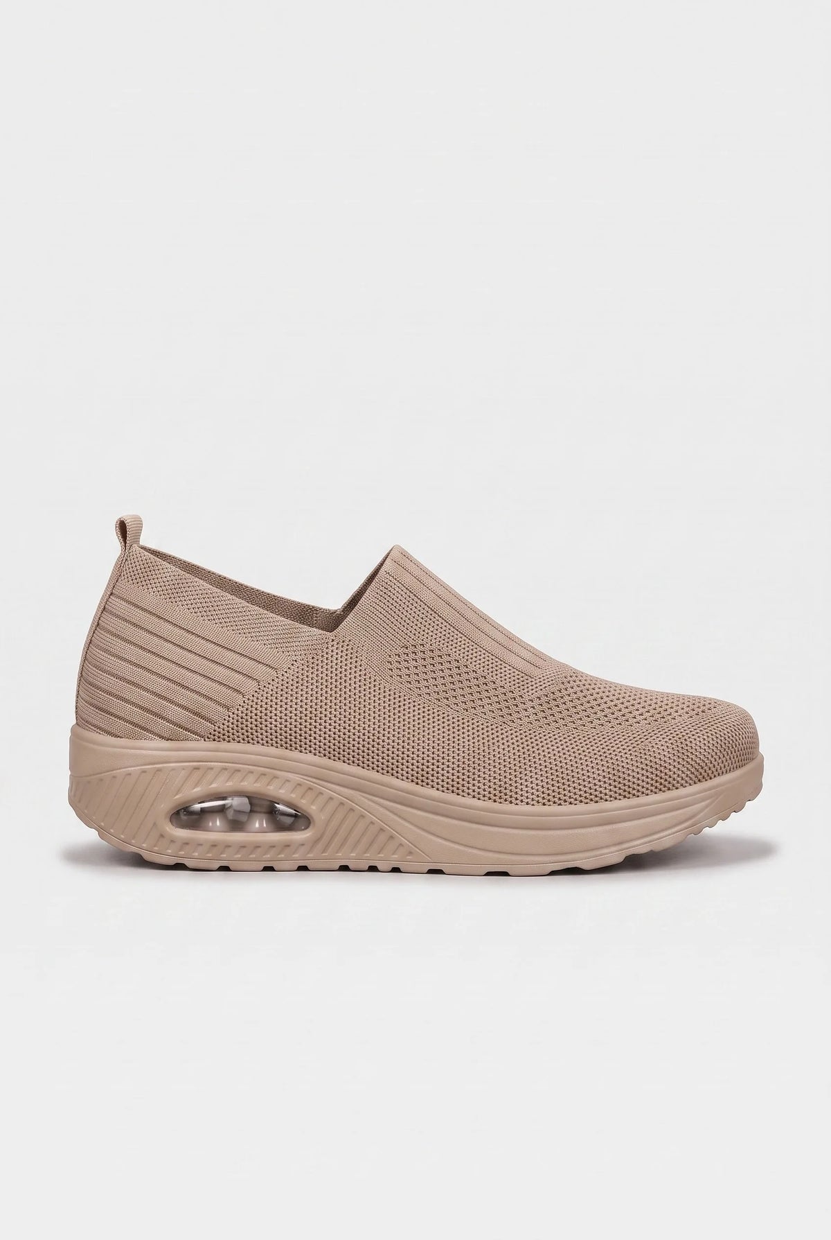 Side profile of light brown knit slip-on trainer with tonal wedge sole and ribbed side panel