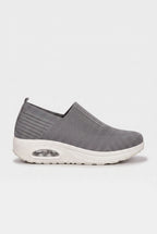 Side profile of grey knit slip-on trainer with contrasting white wedge sole and cushioned air unit