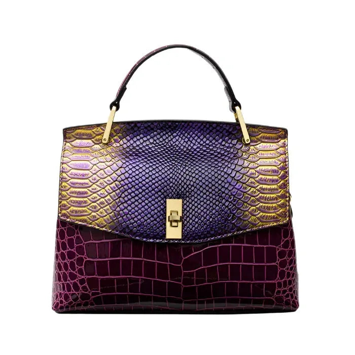 Front view of a structured shoulder bag with a purple snakeskin-effect flap and burgundy crocodile-effect body, gold hardware
