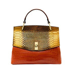 Front view of the shoulder bag in an orange colourway with gold snakeskin-effect flap and croc-effect body