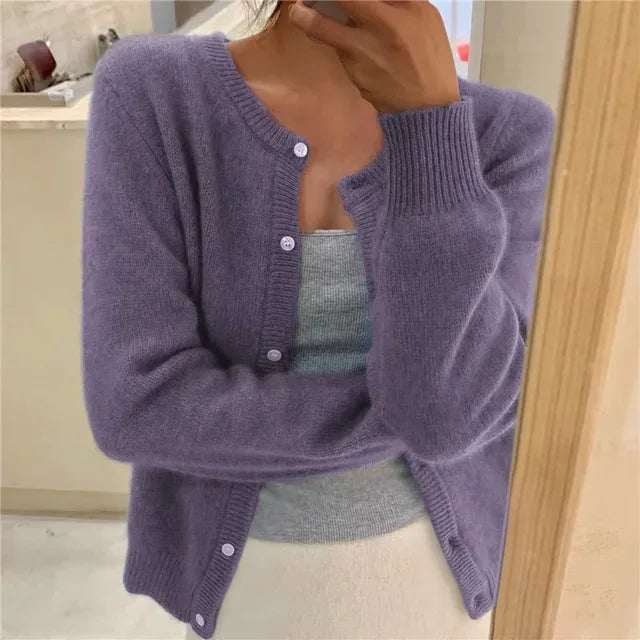 Purple button-front cardigan with round neckline, soft knit texture visible on the sleeves