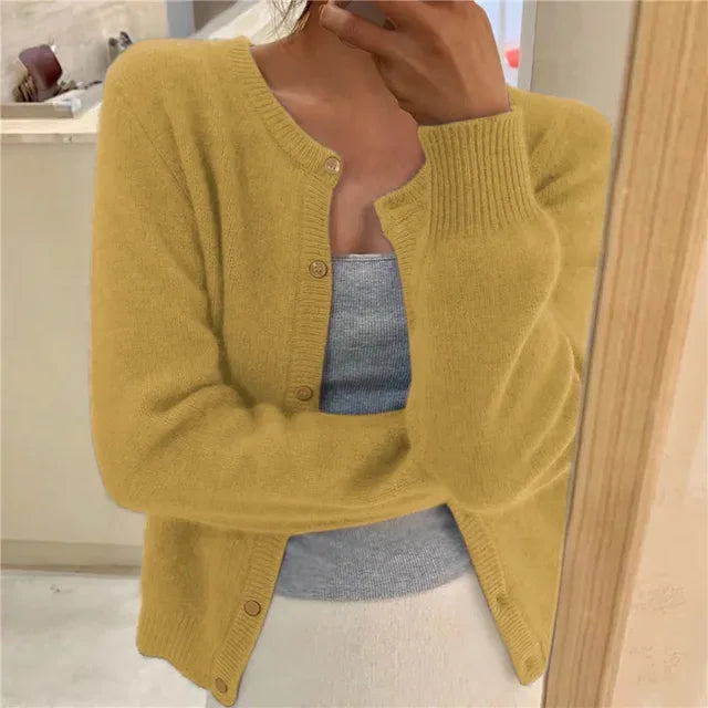 Mustard yellow button-front cardigan with round neckline and ribbed hem, soft knit finish