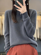 Raspberry red jumper showing the soft brushed knit finish and ribbed trim