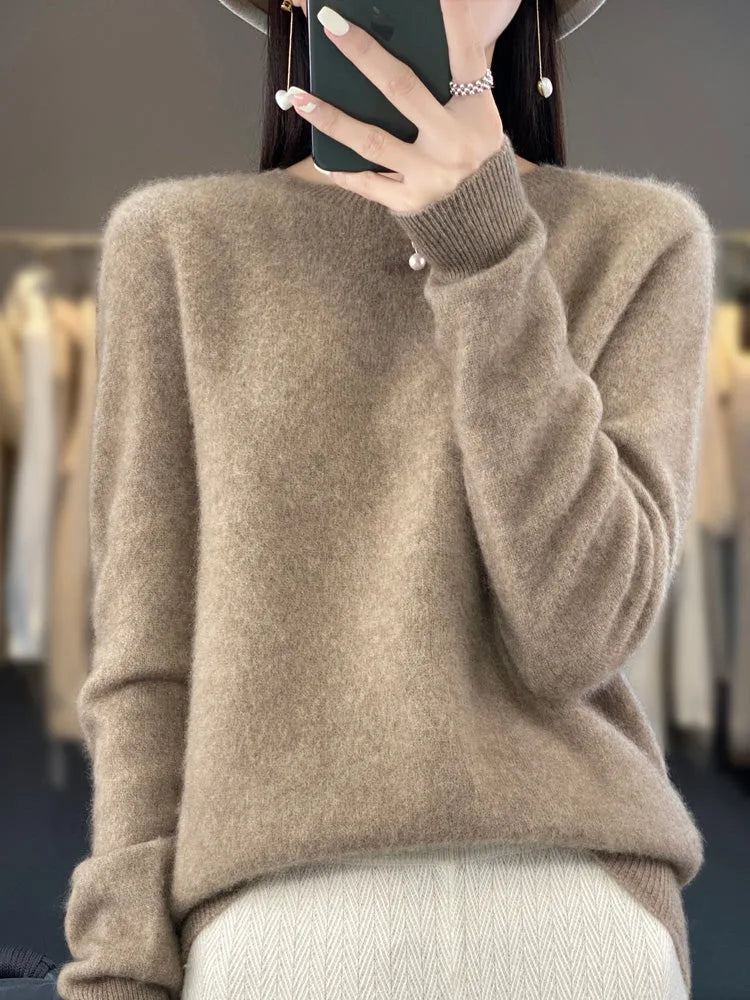 Warm camel brown jumper with a fine knit texture worn over a textured cream skirt