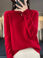Deep red knit jumper with dropped shoulder seams and ribbed hem
