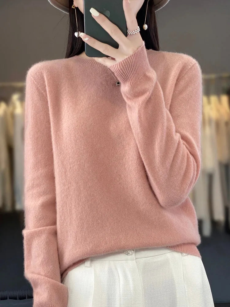 Front view of a neutral beige jumper showing the relaxed fit and soft knit surface