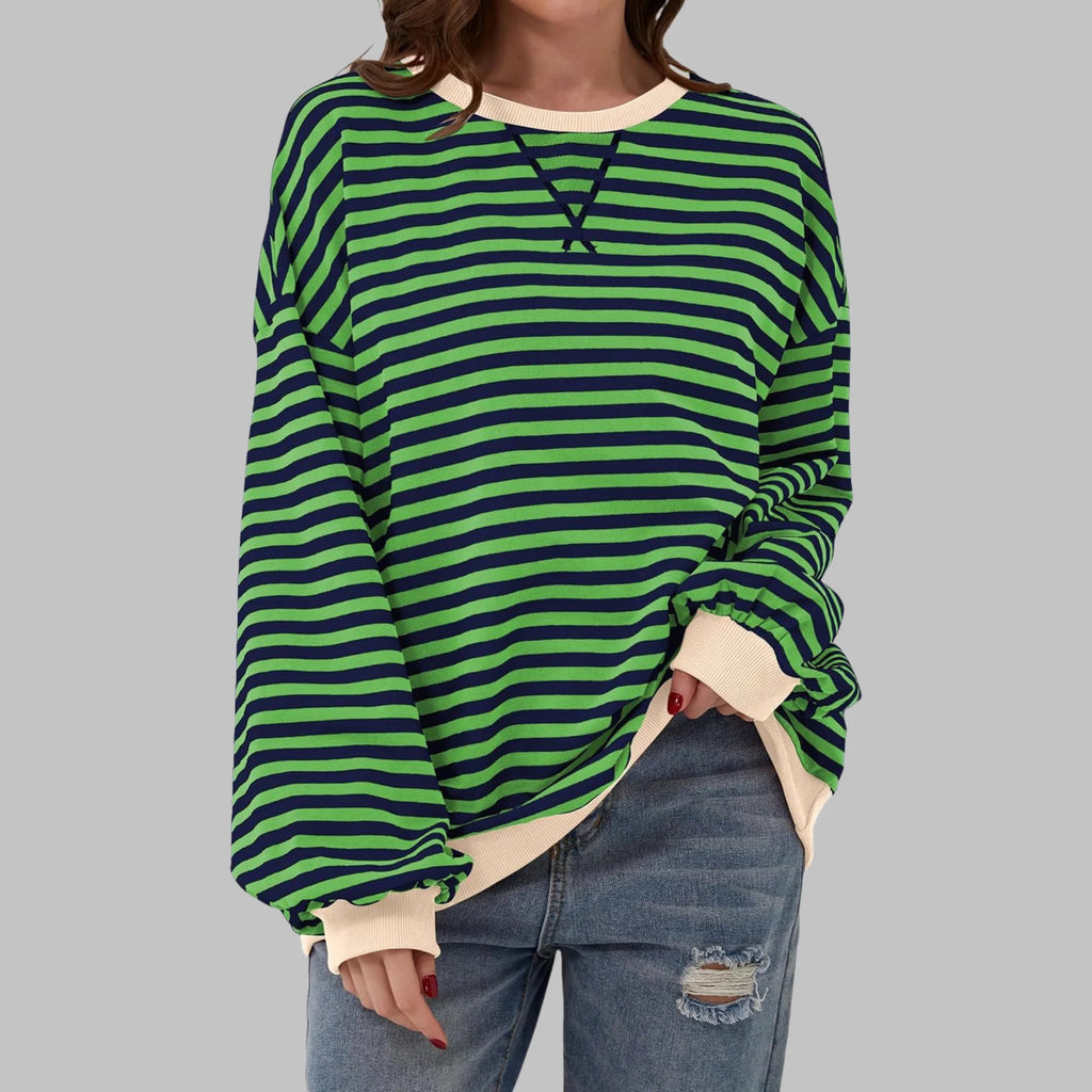 Close-up front view of green and navy striped sweatshirt with contrasting cream ribbed neckline and cuffs