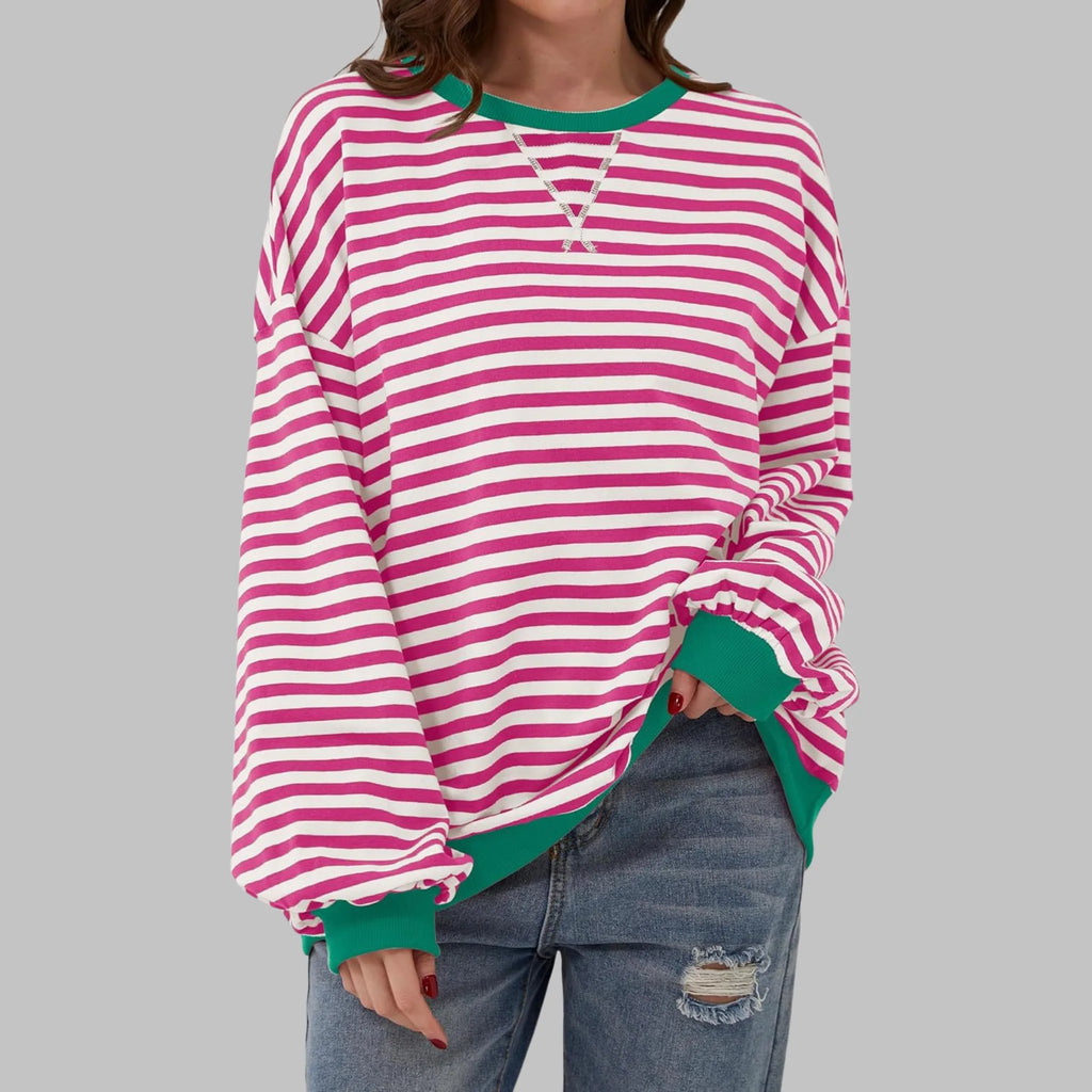 Front view of pink and white striped sweatshirt with contrasting green ribbed collar and cuffs