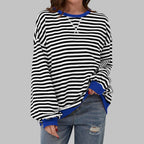 Front view of black and white striped sweatshirt with contrasting royal blue ribbed collar and cuffs