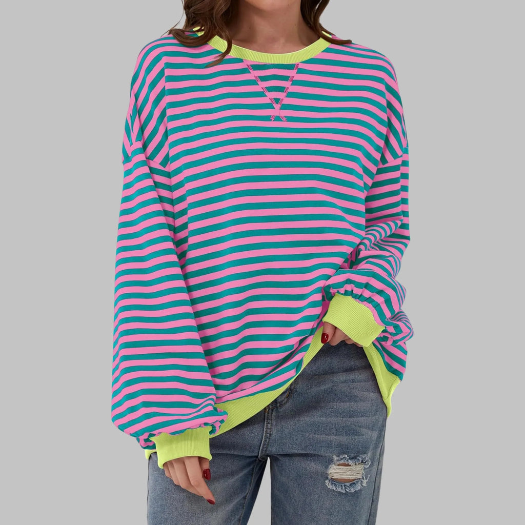 Front view of pink and teal striped sweatshirt with contrasting lime yellow ribbed neckline and cuffs