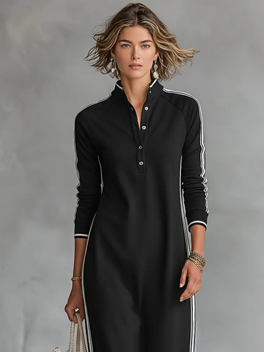 Close-up front view of the black maxi dress highlighting the button-down stand collar and cuff trim