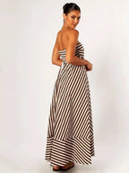 Back view of the strapless striped maxi dress, showing the smooth bandeau back and flowing skirt