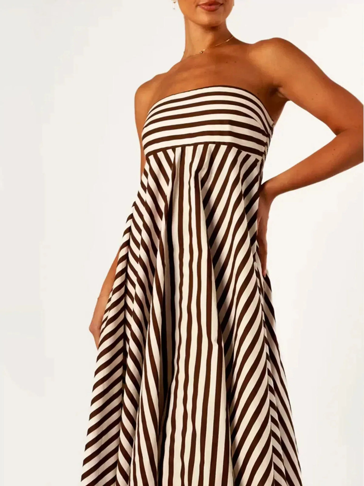 Close-up of the strapless bandeau bodice showing the diagonal striped pattern and gathered waist detail
