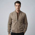 Front view of a man wearing a taupe suede-effect bomber jacket, unzipped over a tonal crew-neck top