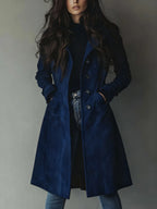 Front view of a dark navy blue suede-style knee-length coat with tailored lapel collar and button placket