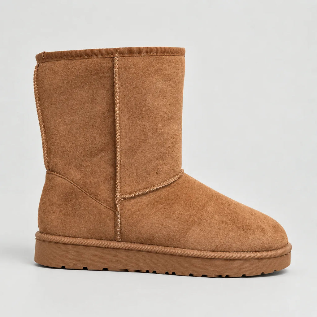 Side profile of a tan suede mid-calf boot with braided stitch detail and a ribbed rubber sole