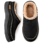 Top and side view of black suede moccasin-style slippers with tan faux fur lining and whipstitch trim