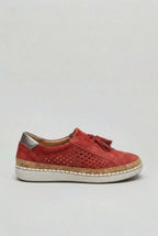 Side view of a red suede slip-on trainer with perforated panel, tassel detail and cork-trimmed white sole