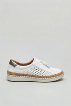 Side view of a white suede slip-on trainer with perforated cut-out design, tassel trim and cork platform sole