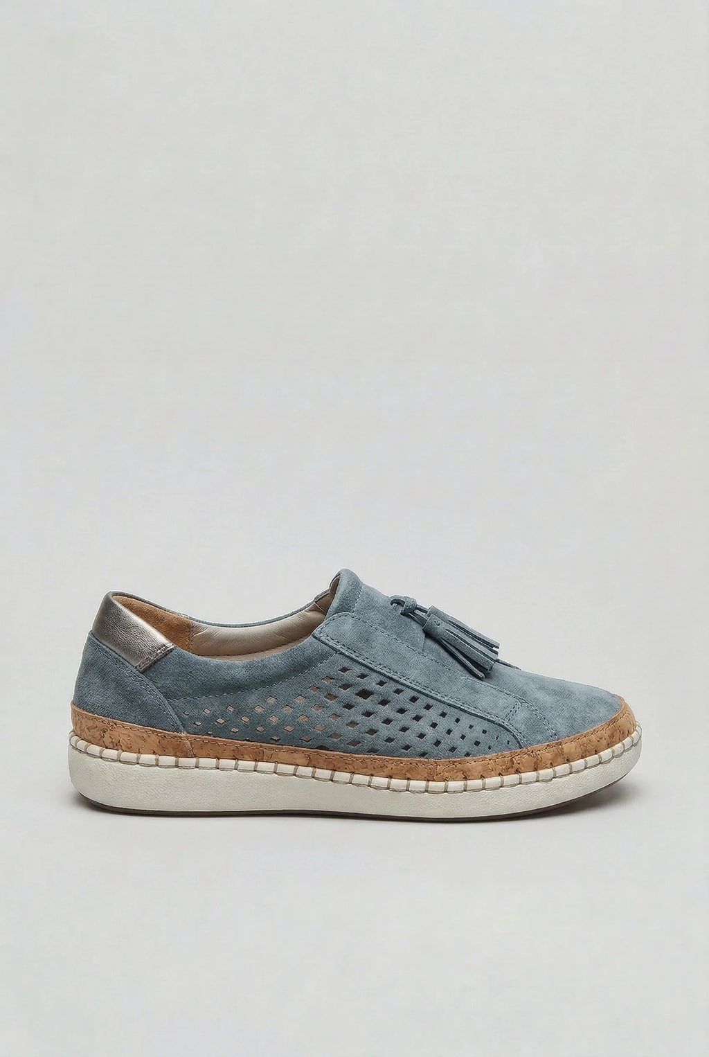 Side view of a light blue suede slip-on trainer with perforated panel, tassel detail and stitched white sole
