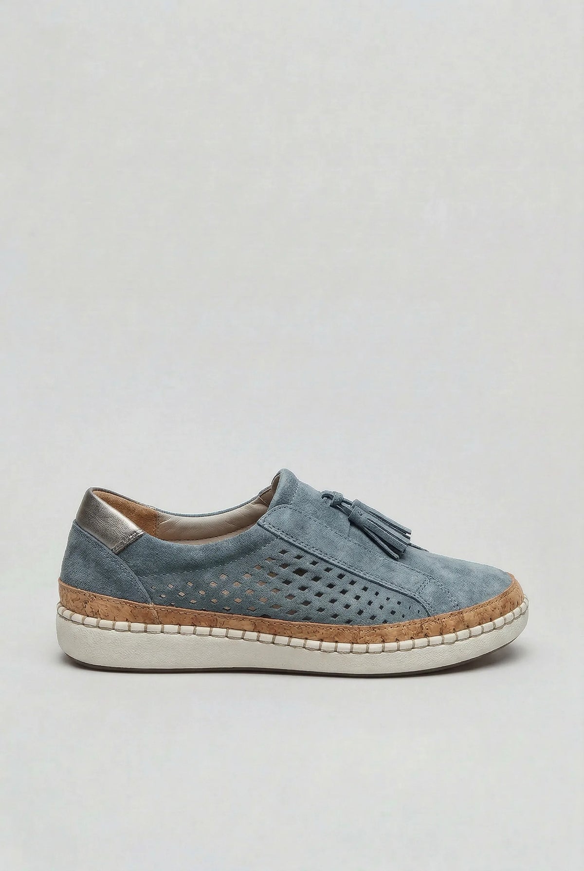 Side view of a light blue suede slip-on trainer with perforated panel, tassel detail and stitched white sole
