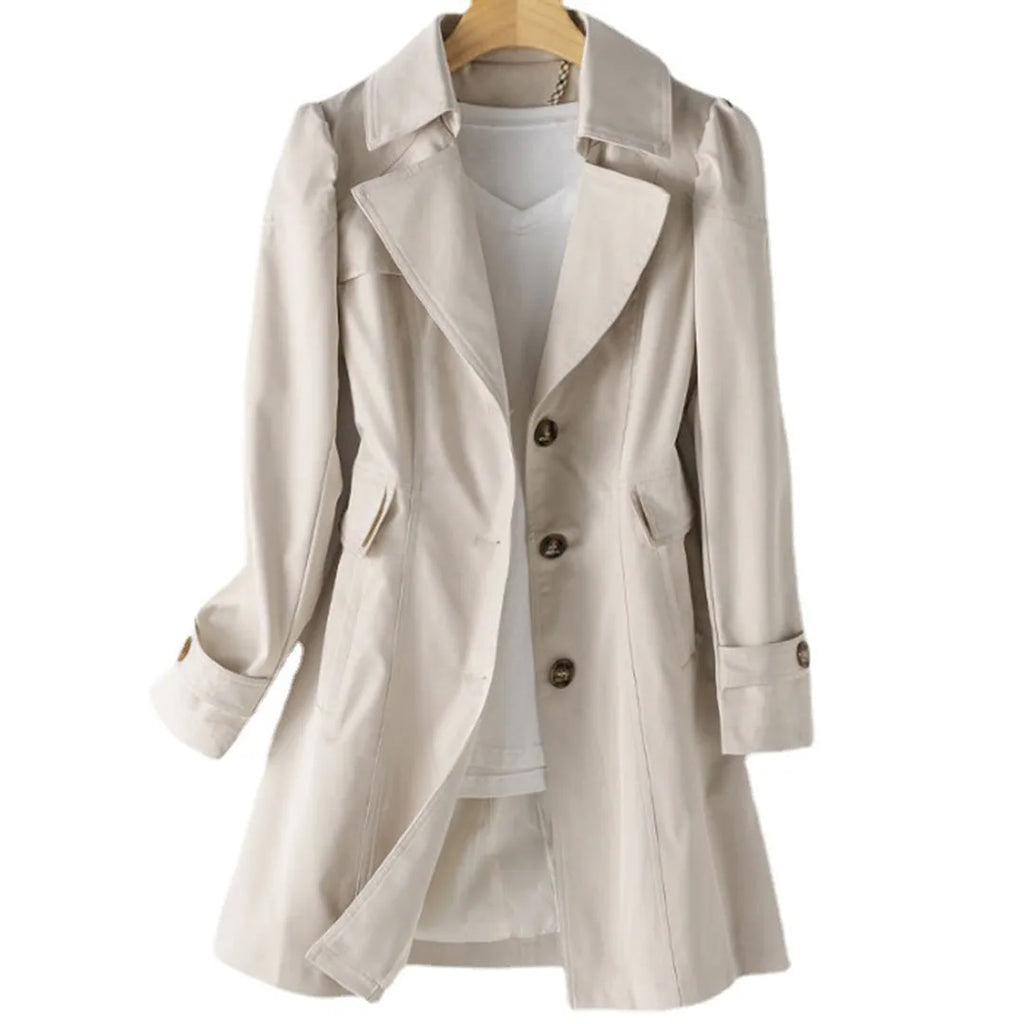 Beige trench coat displayed on a wooden hanger, showing the wide lapel collar and tortoiseshell button placket