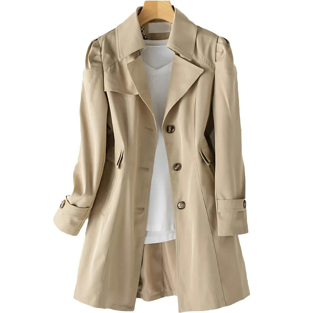 Beige trench coat on hanger with front fully visible, highlighting the fitted waist seam and flap pockets
