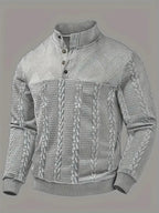 Front flat view of the jumper in grey, showing the full cable-knit pattern and ribbed hem