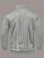 Back view of the grey jumper showing the continuous cable-knit pattern across the shoulders