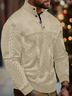 Close-up of the button stand collar and diamond-textured knit panel on the white jumper