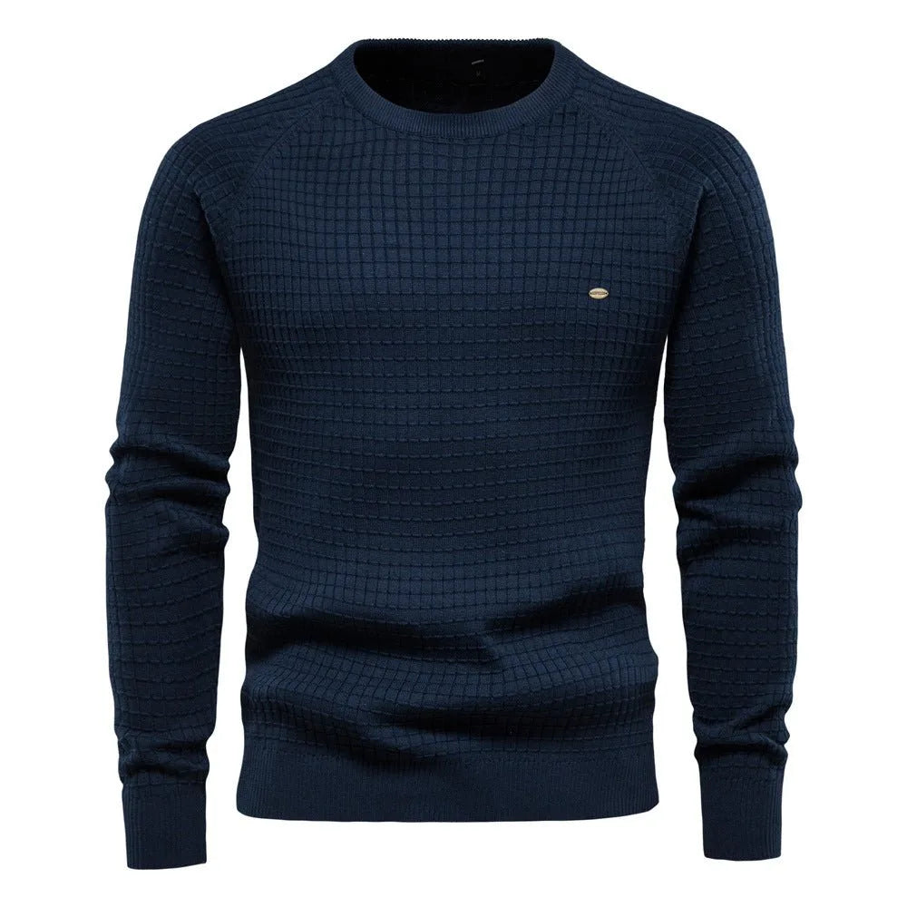 Navy blue textured waffle-knit jumper with ribbed crew neck, cuffs and hem, worn by a man, front view