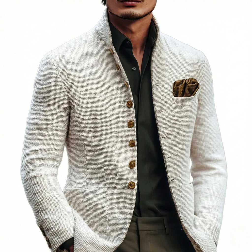 Close-up front view of the white textured jacket on a plain background, showing the button placket and pocket square detail