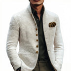 Close-up front view of the white textured jacket on a plain background, showing the button placket and pocket square detail