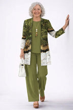 Woman in a green marble-print longline cardigan with olive green top and matching straight trousers