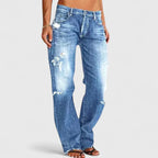 Front view of light blue distressed wide-leg jeans with faded whiskering and ripped knee detail