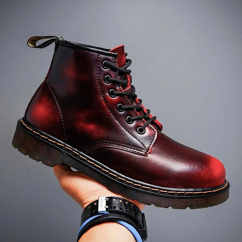 Side view of a crimson red leather lace-up boot showing its distressed ombre tone and black laces