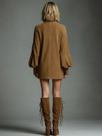Back view of the tan suede mini dress showing the centre seam, raglan sleeves and lace-up suede boots