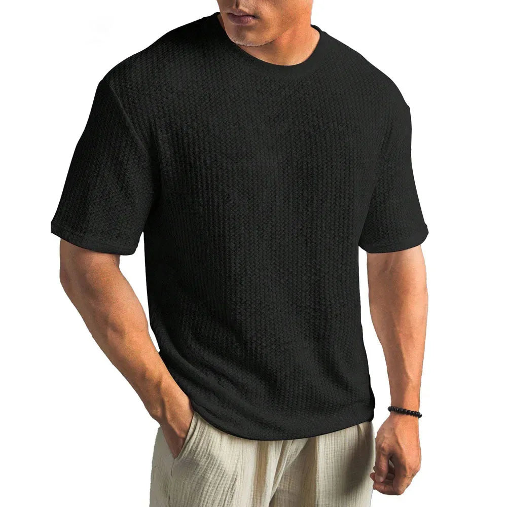 Black textured crew neck T-shirt with a classic fit, shown from the front against a plain background