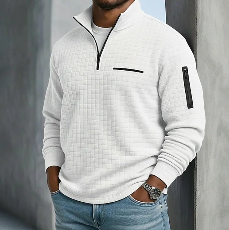 White waffle-textured quarter-zip pullover with contrast black zip and chest pocket trim